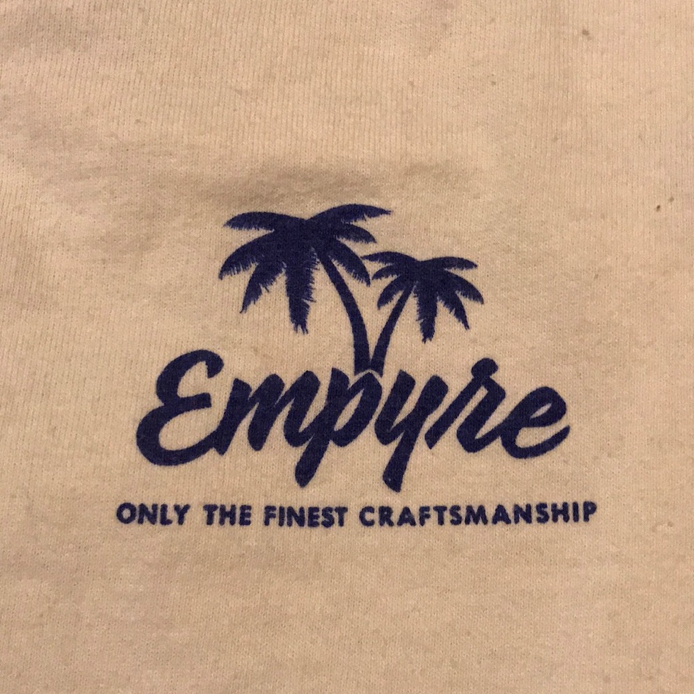 cream t shirt with boat